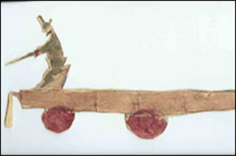 Carved miniature sculpture of man on a cart