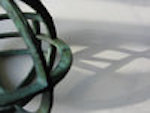 Close-up of bronze orb sculpture