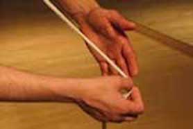 Closeup of dancer's hand holding rope
