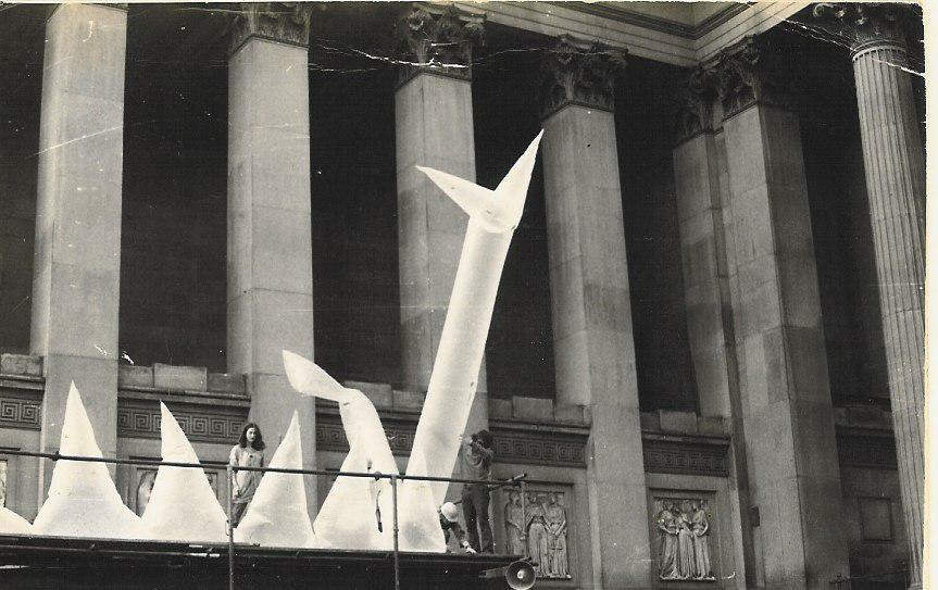 Large inflatable sculpture in front of civic building