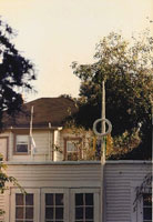 Vertical sculpture with wreath from afar