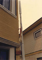 House corner with a vertical sculpture